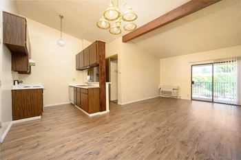 A kitchen and living room in a 555 waverly unit